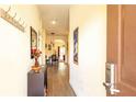 Entryway with wood floors leads to an open dining and living area at 1109 New Providence # 141109, Davenport, FL 33897