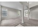 Spacious living area with neutral carpet, paint, and ample natural light at 14342 Fieldstone Lake Way, Orlando, FL 32824