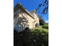 Exterior side view of the two-story home at 402 Big Sioux Ct, Kissimmee, FL 34759