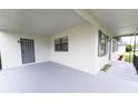 Inviting front porch with secure entrance and storm door, offering a warm welcome at 4469 Evers Pl, Orlando, FL 32811