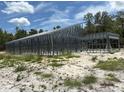 New home construction with steel framework and tall ceilings ready for custom design and finishing touches at 5025 Sw 179Th Pl, Ocala, FL 34473