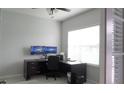 Bright office space featuring a large window and modern workstation setup at 14146 Jomatt Loop, Winter Garden, FL 34787