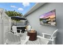 Outdoor patio space featuring a hot tub, fireplace, and TV for relaxation and entertainment at 16262 Firedragon Dr, Winter Garden, FL 34787