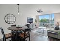 Bright living room with modern furnishings and sliding doors leading to a balcony at 1100 Delaney Ave # F407, Orlando, FL 32806