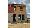 Exterior view of a home under construction with visible framework and materials at 15046 Grove Lake Dr, Winter Garden, FL 34787
