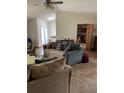 Cozy living room with vaulted ceiling, skylights, comfortable seating, and access to other rooms at 15683 Sw 46Th Cir, Ocala, FL 34473