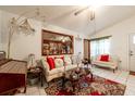 Comfortable living room with bright tile flooring, sofas and a decorative ceiling fan at 1603 15Th, Sanford, FL 32771