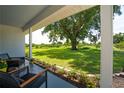 Inviting porch view with comfortable seating, lush greenery, and a picturesque vista of the expansive yard at 2190 Northland Rd, Mount Dora, FL 32757