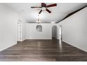 Spacious living room featuring hardwood floors, recessed lighting and white paint at 5671 Sycamore Canyon Dr, Kissimmee, FL 34758