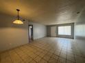 Open living room featuring neutral walls and tile flooring at 220 Cherokee Ct # 116, Altamonte Springs, FL 32701