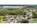 Wide shot of a neighborhood with lush trees, nearby lakes, and neatly arranged homes at 2342 Northumbria Dr, Sanford, FL 32771