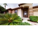 Charming front entrance with a glass front door and lush landscaping at 3552 Macauley Ct, Ocoee, FL 34761