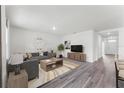 Inviting living room with contemporary furniture, sleek flooring, and plenty of natural light at 5120 Gopher Apple Dr, Apopka, FL 32712