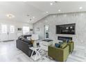 Spacious living room features stylish furniture, modern fireplace, and plenty of room for entertaining at 18623 Tunbridge St, Orlando, FL 32833