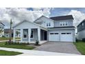 Charming two-story home with a two-car garage and inviting covered entry at 6221 Argent Wood Dr, Winter Garden, FL 34787