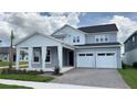 Charming two-story home with a two-car garage and inviting covered entry at 6221 Argent Wood Dr, Winter Garden, FL 34787