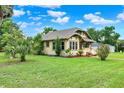Well-maintained single-Gathering home with a vibrant green lawn and mature trees with lots of curb appeal at 1013 W 20Th St, Sanford, FL 32771