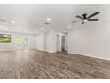 Spacious living room with modern flooring, recessed lighting, and a ceiling fan at 575 Lake Mccoy Dr, Apopka, FL 32712