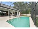 Relaxing screened-in pool area featuring ample seating and a serene backyard view at 6839 Hidden Glade Pl, Sanford, FL 32771