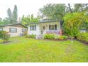 Charming home with a well-manicured lawn, quaint porch, and patriotic decorations at 805 E 20Th St, Sanford, FL 32771