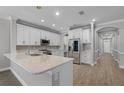 Well-equipped kitchen with stone countertops and stainless steel appliances at 12524 Aldershot Ln, Windermere, FL 34786