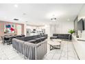 Open-concept living area featuring a dining space and kitchen; perfect for entertaining at 2613 Calistoga Ave, Kissimmee, FL 34741