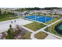 Aerial view of community park and playground with recreational areas at 2053 Starflower Ln, Kissimmee, FL 34746