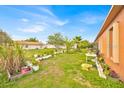 A sprawling backyard with lush greenery and ample space, ideal for relaxation and recreation at 675 Elbridge Dr, Kissimmee, FL 34758