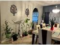 Dining room with lots of decorations and dining table with chairs at 675 Elbridge Dr, Kissimmee, FL 34758
