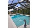 Relaxing screened-in pool with beautiful blue water and outdoor seating area, perfect for entertaining guests at 10411 Sw 52Nd Ct, Ocala, FL 34476