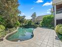 Private backyard pool with lush landscaping and a spacious patio area for entertaining and relaxation at 10621 Sw 11Th Ter, Ocala, FL 34476