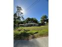 Single story house with yard, viewed from the street at 6044 Nw 65Th Pl, Ocala, FL 34482