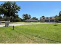 Gray house with stone accents and a large yard at 274 Se 34Th Pl, Ocala, FL 34471