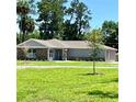 Ranch style home with stone and gray siding at 274 Se 34Th Pl, Ocala, FL 34471