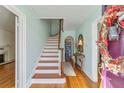 Bright entryway with hardwood floors and a staircase at 1226 Se 9Th Ave, Ocala, FL 34471