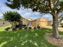 Charming single-story home featuring a lush green lawn and well-maintained landscaping at 16026 Sw 14Th Avenue Rd, Ocala, FL 34473