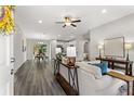 Open living room showcasing a comfy sofa, stylish console table, and wood-look floors at 16612 Sw 31St Cir, Ocala, FL 34473