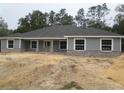 Charming single-story home showcasing stone accents and a symmetrical front facade at 13083 Sw 61St Place Rd, Ocala, FL 34481