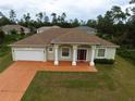 Well-maintained single-Gathering home with a charming facade and a manicured front lawn at 15747 Sw 47Th Avenue Rd, Ocala, FL 34473