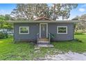 Charming gray house with red roof and front steps at 3331 Se 11Th Ave, Ocala, FL 34471