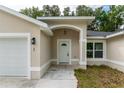 White front door with arched entryway and sidelights at 1 Pine Trace Trl, Ocala, FL 34472