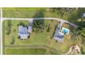 Two houses, pool, and expansive green space at 7137 & 7141 S Magnolia Ave, Ocala, FL 34476
