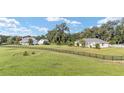Two houses and lush green landscape at 7137 & 7141 S Magnolia Ave, Ocala, FL 34476