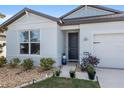 House exterior showcasing front entrance and landscaping at 9459 Sw 52Nd Loop, Ocala, FL 34481