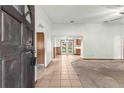 View of the front entrance featuring a tiled floor and an archway leading to a separate room at 5721 Se 22Nd Pl, Ocala, FL 34480