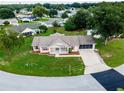 Single-story house with a two-car garage and large yard at 8981 Sw 116Th Place Rd, Ocala, FL 34481