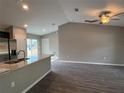 Open living room with hardwood floors and neutral wall colors at 4030 Se 134Th St, Belleview, FL 34420