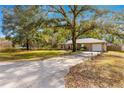 House with a long driveway and large yard at 6990 Se 122Nd Ln, Belleview, FL 34420