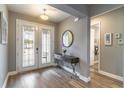 Bright and airy entryway with hardwood floors and elegant double doors at 9124 Sw 84Th Ln, Ocala, FL 34481