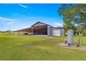 Spacious barn with open sides and a covered area at 1000 Se 155Th St, Summerfield, FL 34491